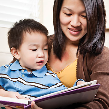 A woman reading to her son. Links to Gifts of Appreciated Securities A woman reading to her son. Links to Gifts of Appreciated Securities