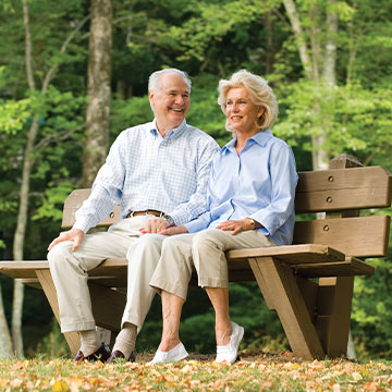 A man and his wife sitting on a bench outdoors. Links to Gifts of Cash, Checks, and Credit Cards A man and his wife sitting on a bench outdoors. Links to Gifts of Cash, Checks, and Credit Cards