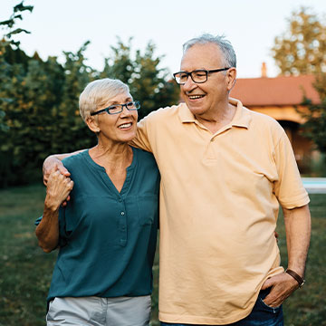 A man wraps his arm around his wife's shoulders as they take a stroll outdoors. Links to Gifts of Life Insurance A man wraps his arm around his wife's shoulders as they take a stroll outdoors. Links to Gifts of Life Insurance